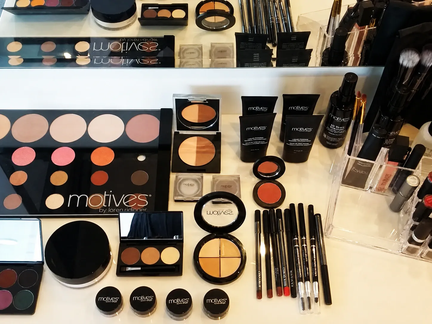 Professional makeup products and brushes used by The Beautician