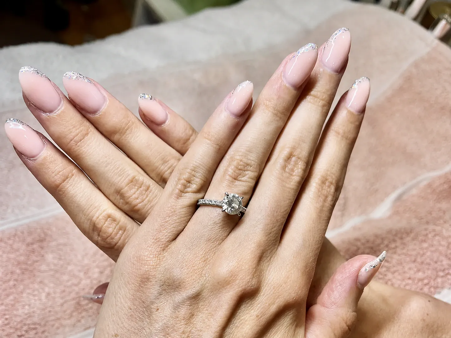 Pale pink nails with silver glitter tips by The Beautician