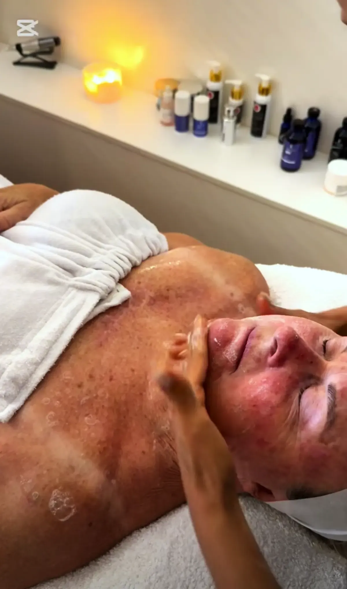 Client receiving a relaxing face and upper-body treatment